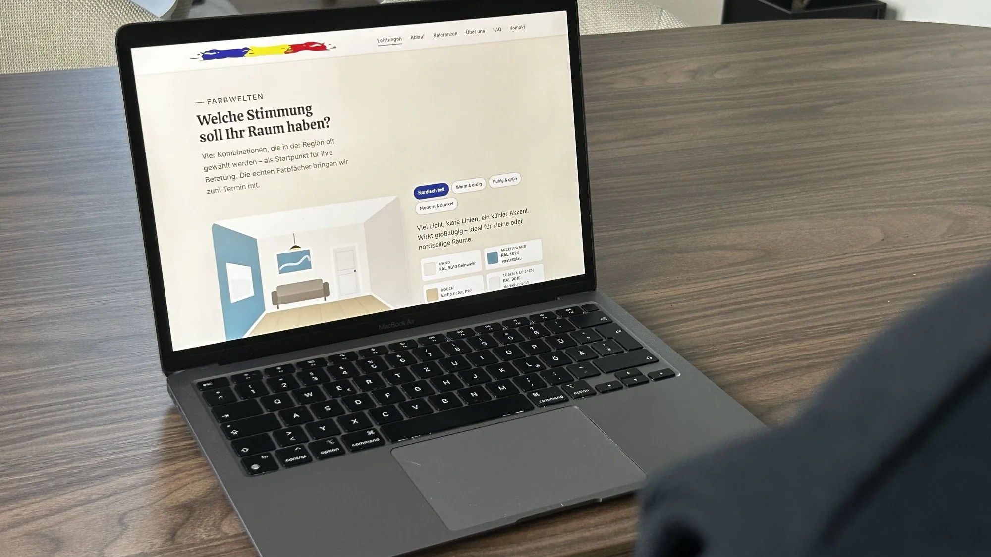 Laptop on a table showing the colour schemes page of Malerbetrieb Viktor Hirt